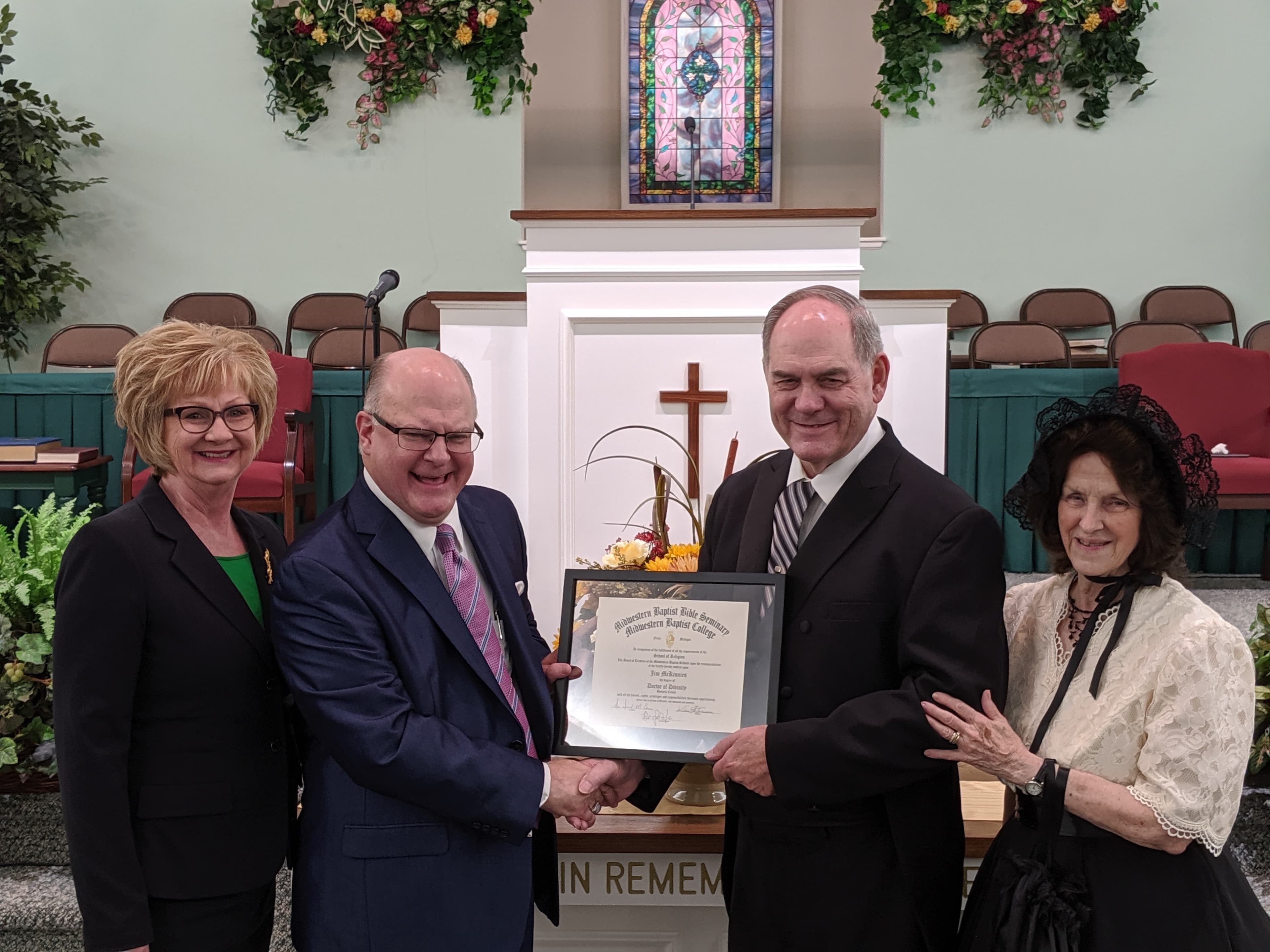 Dr. Jim McKinnies receiving recognition during a Willis Baptist Church anniversary celebration.